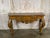 An exquisite Italian Rococo Revival console table, a true statement of Old World craftsmanship and timeless grandeur. This...