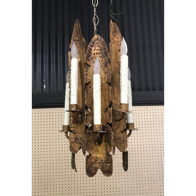 Mid-century modern brutalist torch cut chandelier with 8 lights. Tom Greene for Feldman Lighting