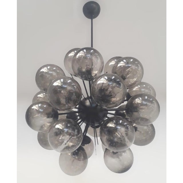 Italian sputnik chandelier with 24 smoky Murano glass globes carefully hand blown with bubbles inside the glass using...