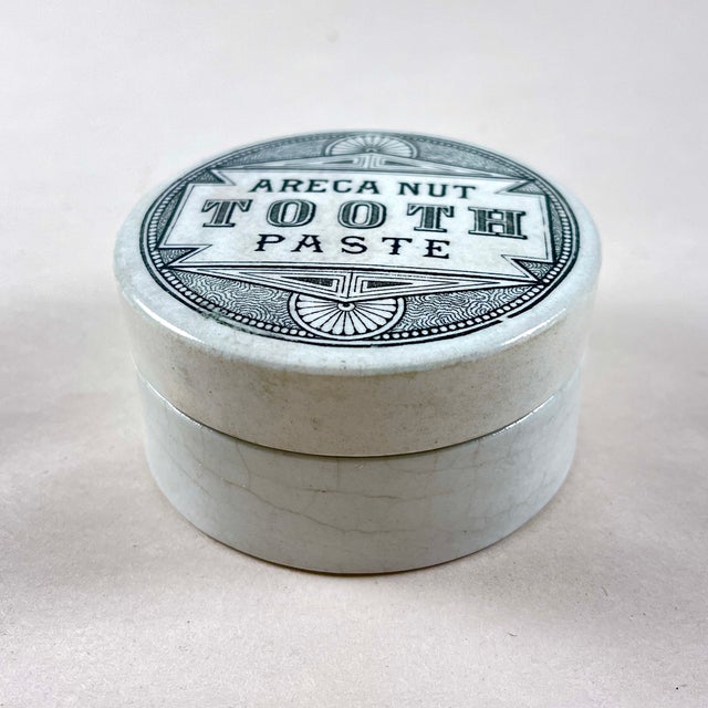 An Areca Nut Toothpaste pot, Staffordshire, England, circa 1880. Transfer printed in black on a creamy white earthenware,...