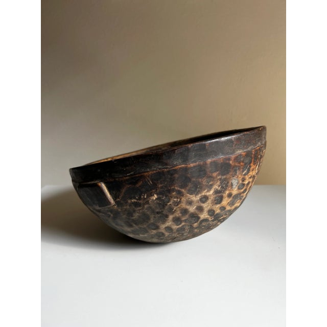 This hand-carved milk bowl from West Africa is a one-of-a-kind vintage piece, believed to have been crafted by the Fulani...
