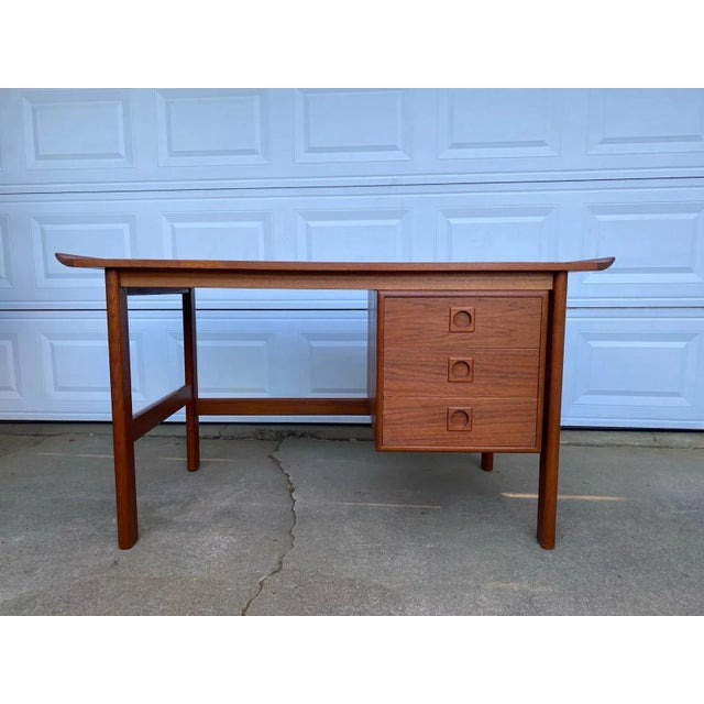 Stunning Danish Teak Home Writing Desk Circa 1960; Denmark this Scandinavian desk with rectangular top with curved ends...
