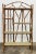 Stunning and substantial five tier wood and bamboo bookshelf featuring a Chinoiserie style look with a scorched bamboo...