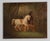This oil painting dates to the early 19th century, circa 1820–1840. The composition depicts two horses in a wooded...
