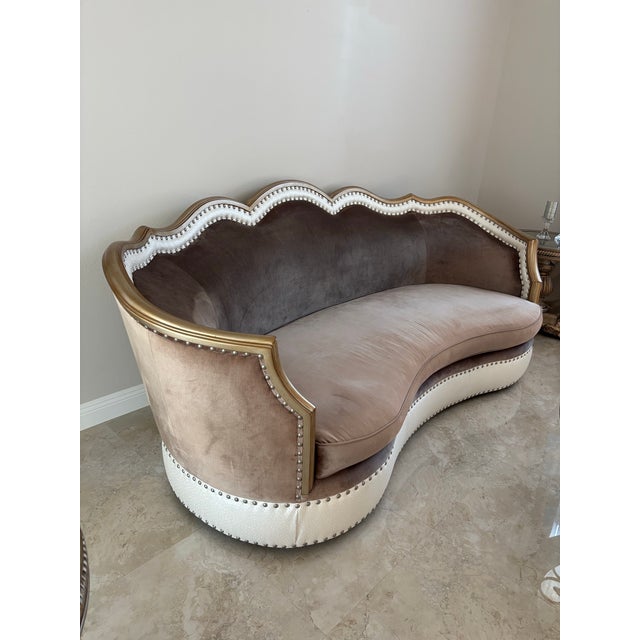 Elevate your space with this stunning, designer-style curved sofa that blends elegance and comfort effortlessly....