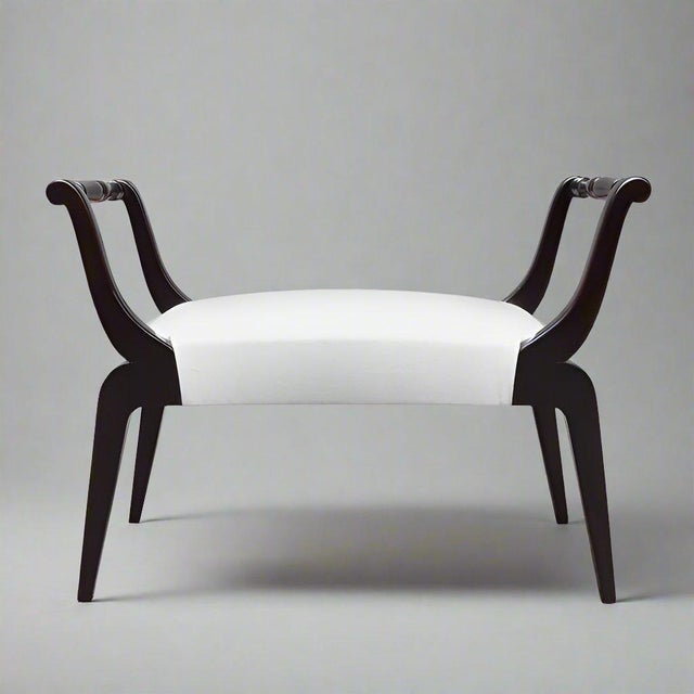 An ebonized Italian Mid Century bench. Ebonized Beech wood with tapered legs and carved detaials on the armrests.