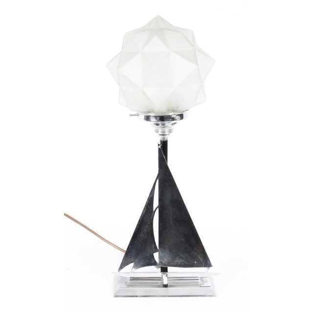 This is a beautiful antique Art Deco lamp depicting a chrome yacht with sail, circa 1920 in date. This lamp has a...