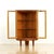 This fabulous mid century corner display cabinet was manufactured by Turnidge of London during the 1950s. Produced in teak...