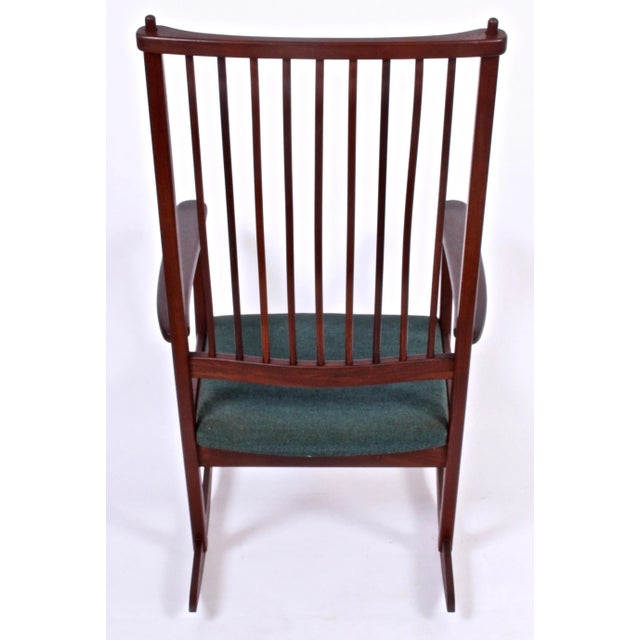 Scandinavian Modern Ynge Ekstrom for Swedes solid Rosewood Rocking Chair. Design attributed to Karl-Erik Ekselius....