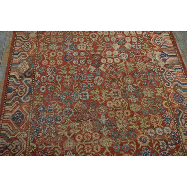 Chinese Central Asian Khotan Rug With Unusual Floral Motif Pattern on Persimmon Background Color For Sale - Image 3 of 10