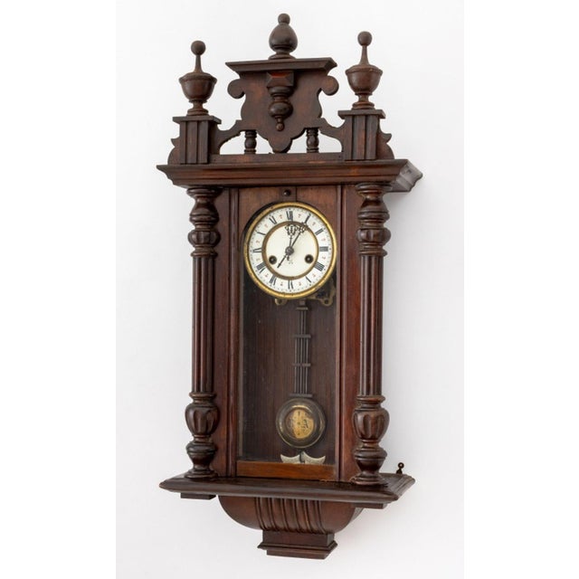 Vienna Mahogany Regulator Wall Clock, circa 1900, with carved urn finial and fluted column crest, porcelain and brass...