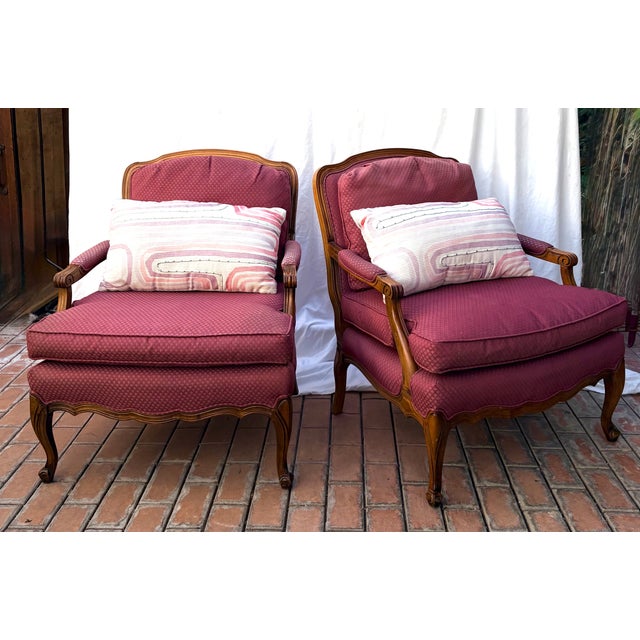 A pair of classic Louis XV style Bergere chairs from Sam Moore of Virginia. Upholstered Cushions: Deep comfortable seats...