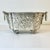 Vintage Home is pleased to present this Antique hand wrought hammered silverplated planter. It was curated from an estate...