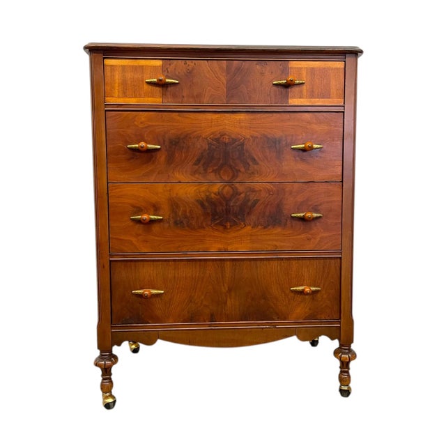 A beautifully crafted antique dresser showcasing early Art Deco influences ,featuring four spacious drawers accented with...