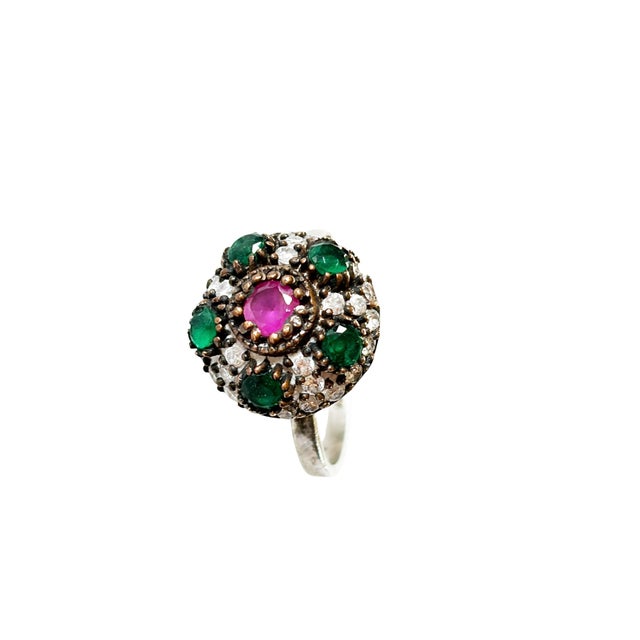 This fabulous vintage hand-made sterling silver statement ring from Jaipur, India features ruby, emerald, and sparkling...