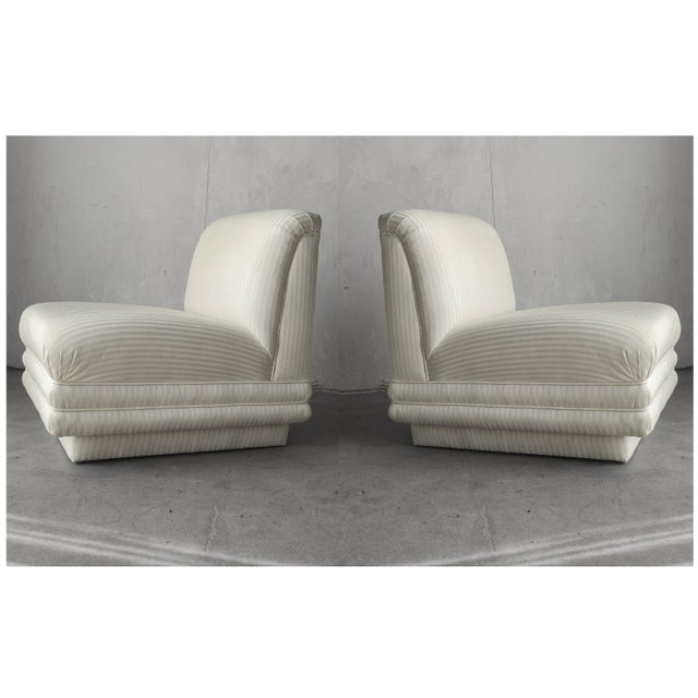 Incredible and large, pair of post modern slipper chairs on a plinth bases. These beauties truly have lines worth...