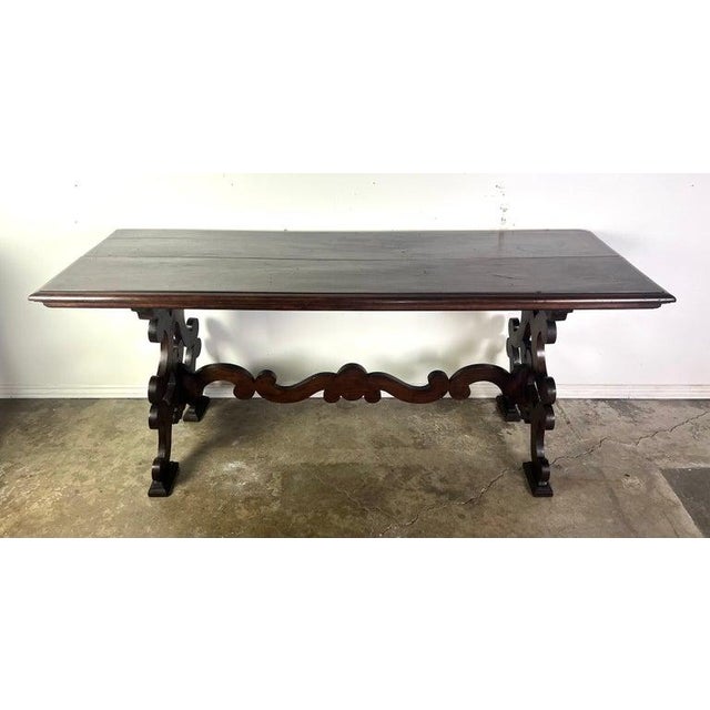 19th-century Italian Baroque style console table, standing on two pedestals made from scrolls and connected by a center...