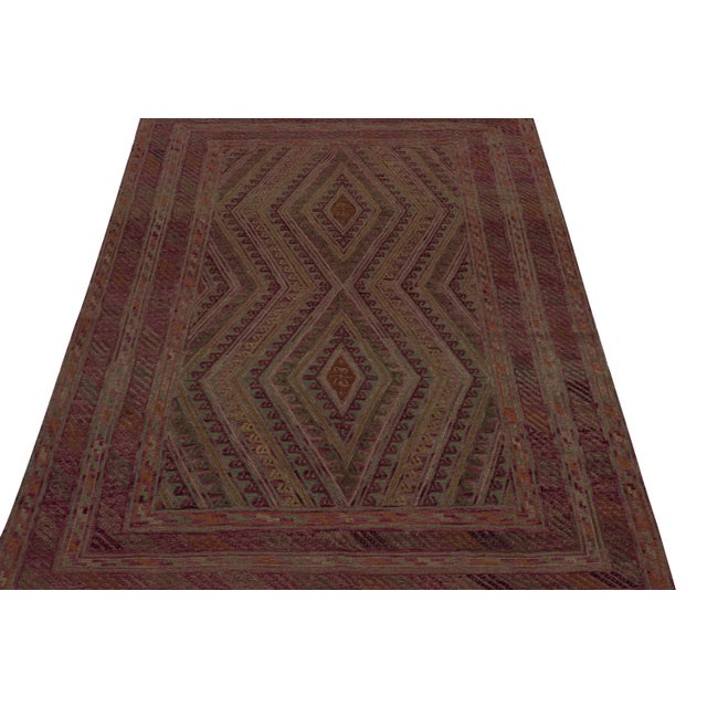 Hand knotted in wool, this 7x9 Baluch rug represents a new line of tribal carpets in the Modern Classics Collection by Rug...