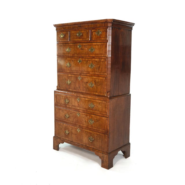 Walnut chest on chest with upper section of three short drawers over three long drawers above a lower section of three...