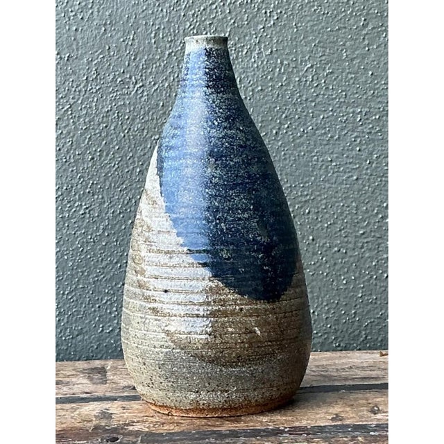 Exuding refined organic elegance, this exceptional vintage abstract ceramic vase embodies the tactile beauty and...