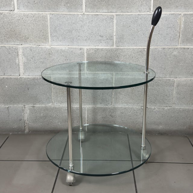 A piece of furniture that perfectly embodies the rationalist elegance of the 1980s and 1990s. This prestigious circular...