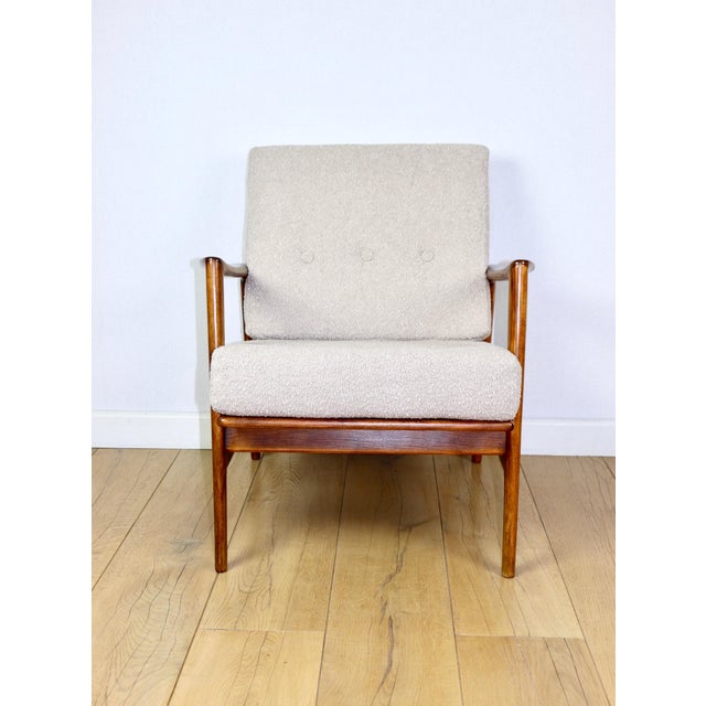 PRL armchair "Stefan" made of oak wood, vintage style, upholstered in beige and gold boucle fabric. 3 pieces available....