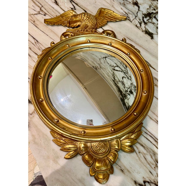 Vintage Syroco Federal Style Convex Eagle Mirror featuring a beautifully detailed gilt finish with classic Americana...
