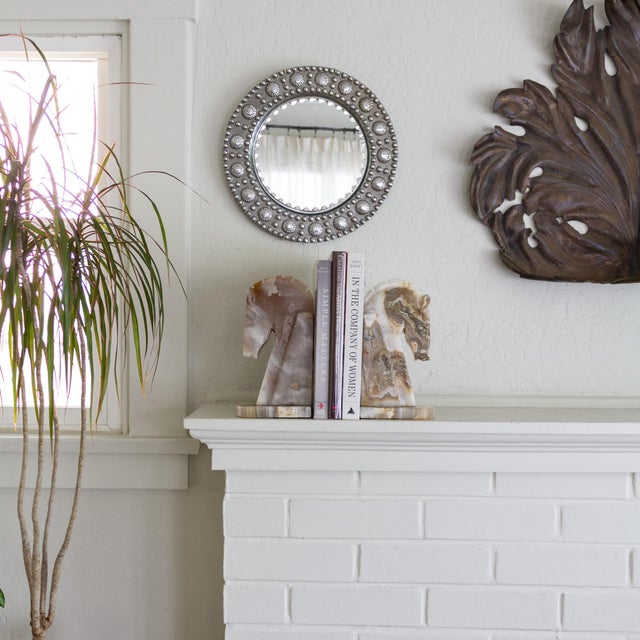 A pair of large vintage Art Deco style Trojan Horse onyx bookends. The colors include mauve, ochre, taupe, and creamy...