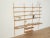 A classic wall shelf from the 1960s. The high-quality shelves are veneered in oak. The system consists of 17 shelves and...