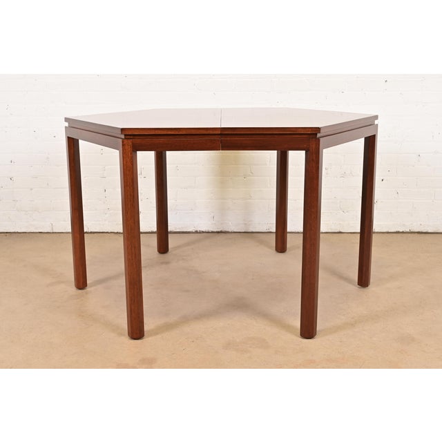An exceptional Mid-Century Modern hexagonal dining table or game table in gorgeous book-matched rosewood By Edward Wormley...