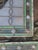 Art Nouveau style floral and ribbon or wreath motifs, complete with green and white opalescent/textured glass and jewel...