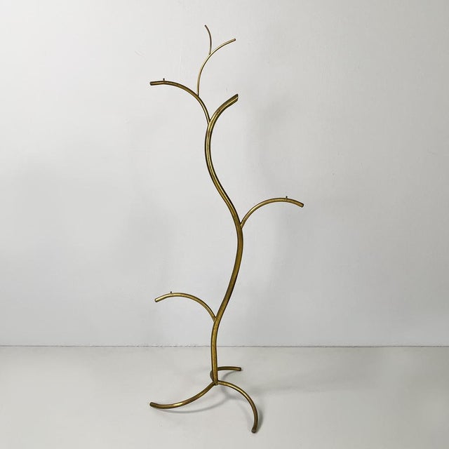 Floor display with brass rod structure. Three-legged base in brass rod. Can also be used as a small hat hanger. 1950s Good...