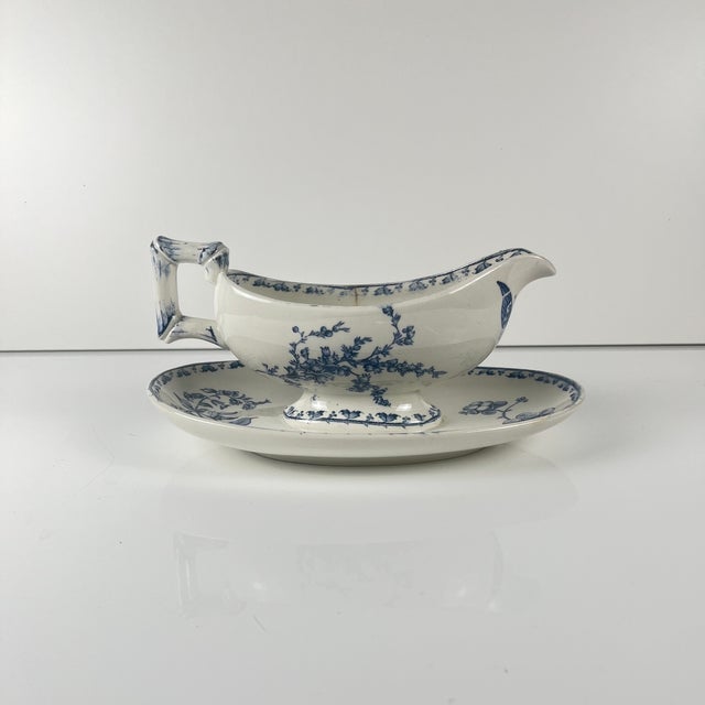 Ironstone gravy boat "Carmen", Sarreguemines, blue, 1875-1900 Floral and insect decoration Dimensions: 24 x 14 cm Height:...