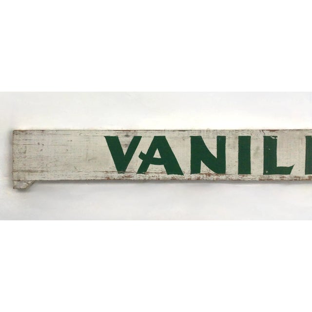 Circa 1940s/50s wood two sided hand lettered green and white Vanilla sign from an ice cream shop, has metal hanger...
