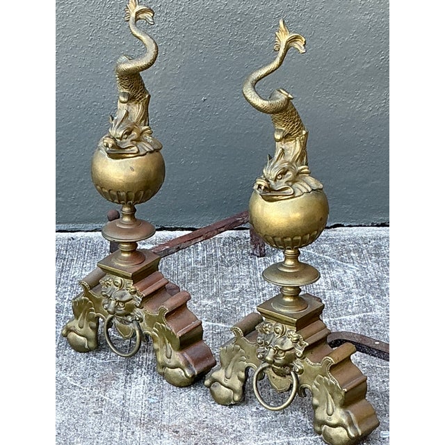 This exquisite pair of vintage brass andirons embodies the grandeur of Neoclassical and Baroque revival design....