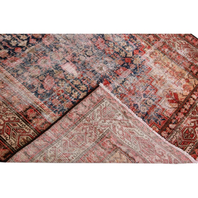 Beautiful Vintage Floral hand-knotted wool rug with a brown field. This rug has blue accents all-over a geometric floral...