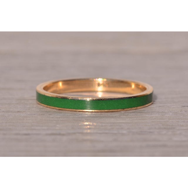 The Montecchio: Vintage Green Enamel Stackable Band in Yellow Gold. The ring features a central row of smooth green enamel...