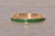 The Montecchio: Vintage Green Enamel Stackable Band in Yellow Gold. The ring features a central row of smooth green enamel...