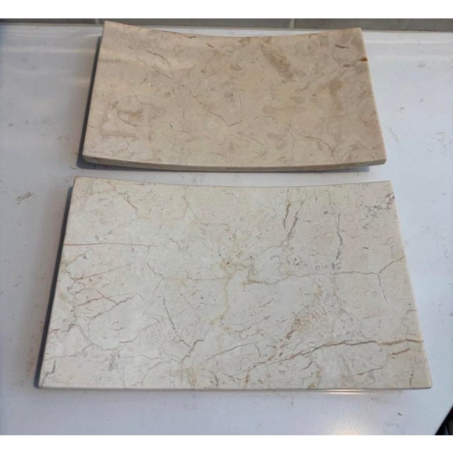 Elevate your vanity, nightstand, or coffee table with this elegant pair of solid marble decorative trays from Frontgate....