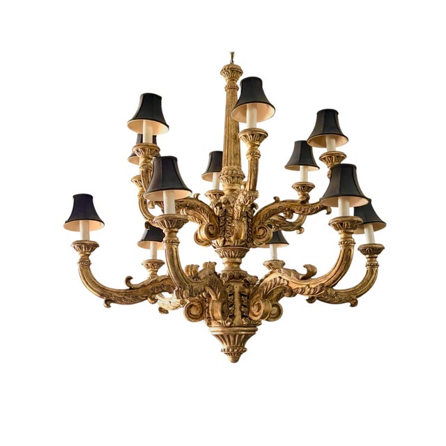 Early 20th century monumental impressive Italian hand carved and giltwood chandelier. Superior carving on twelve arms,...