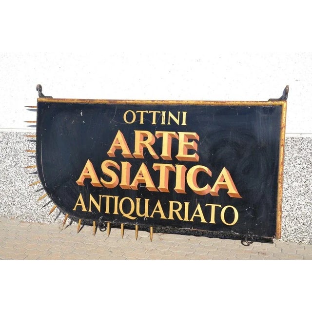 This vintage sign from an antique shop was produced in Italy in the 1950s.