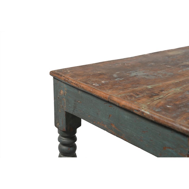 This Vintage Indian Teakwood Low Table is handcrafted from solid teakwood, featuring a generously sized plank top,...