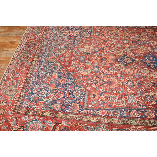 an early 20th Century Corridor Size Northwest Persian red and blue rug. The medallion was intentionally woven off the...