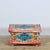 This folk art box from the 1950s is a particularly decorative object with an authentic, hand-painted appearance. The...