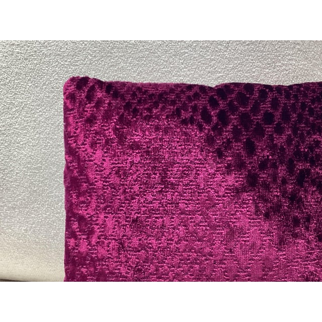 Knife edge, cut velvet fabric pillow in a saturated Fuchsia tone. The texture features an irregular embossed like pattern,...