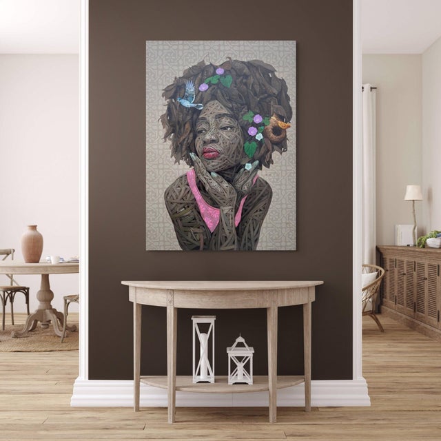 The artwork features a striking portrait of a figure adorned with intricate layers of textured elements, blending natural...