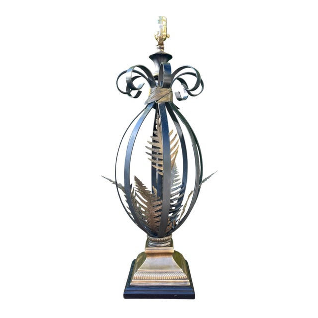A striking vintage sculptural table lamp by John-Richard featuring an openwork metal frame adorned with layered fern leaf...