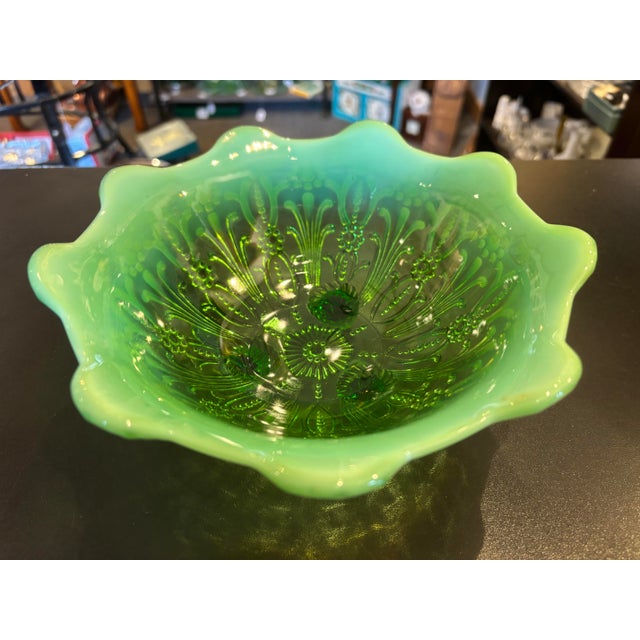 This is a stunning green bowl made by a Northwood glass in the beautiful pearl flower pattern. It has a gorgeous green...