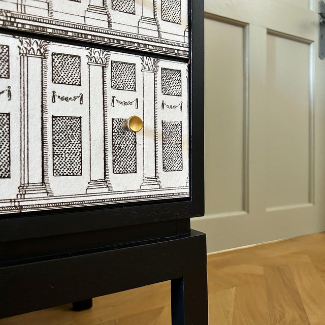 This vintage, solid wood cocktail sideboard is a stunning fusion of Neo-classical architectural style and the sleek,...