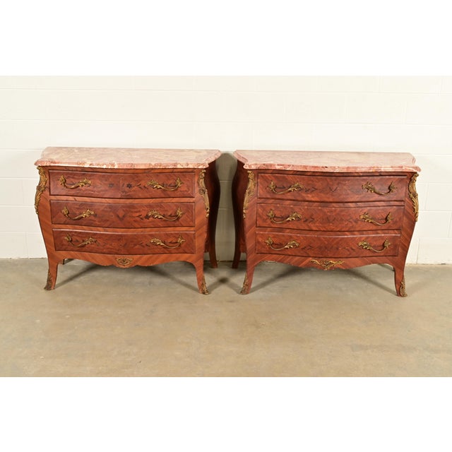 A gorgeous pair of antique French Provincial Louis XV style bombay form commodes, dressers, or chests of drawers In the...